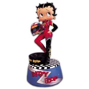  Betty Boop Standing On Stage In Racing Suit Holding Her 