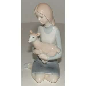 Woman Kneeling & Holding A Fawn Porcelain Figurine