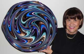 Up for auction is a unique piece of hand blown glass art