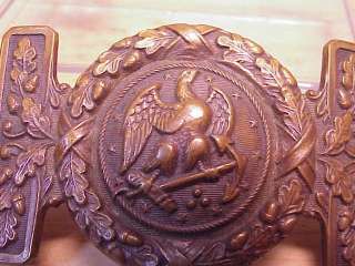   officers sword belt buckle with the spread winged eagle holding an