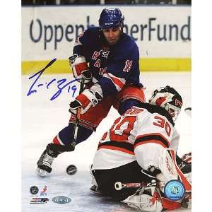  NHL Scott Gomez Shot Vs Devils Autographed 8 by 10 Inch 