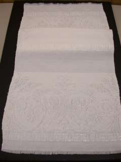 Cotton Blend. Machine Wash and Dry. Measures 16 x 38 inches. Has 