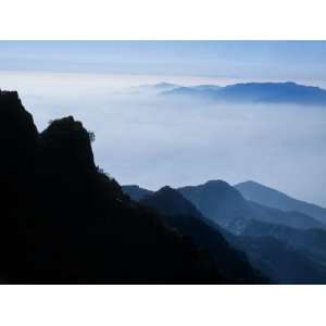 com Lone Figure Stands on a Cliff of Mt. Tai During the Moon Festival 