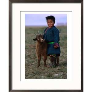  Boy Wearing Traditional Dell Standing Next to Baby Goat 