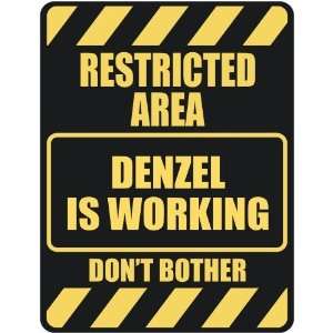   RESTRICTED AREA DENZEL IS WORKING  PARKING SIGN