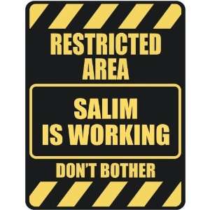   RESTRICTED AREA SALIM IS WORKING  PARKING SIGN