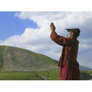  China, Western Sichuan Province, Tibetan Monk Praying in 