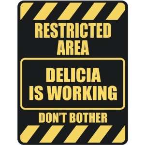   RESTRICTED AREA DELICIA IS WORKING  PARKING SIGN