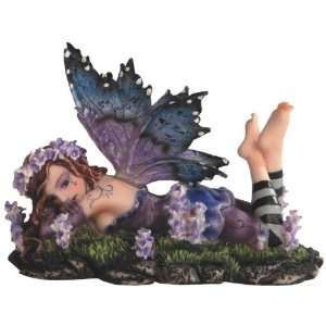  Small Purple and Blue Fairy Lying on Grass with Flowers 