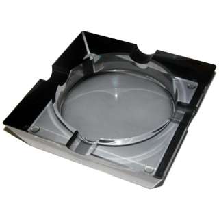 This four cigar ashtray is made from semi transparent black tinted 