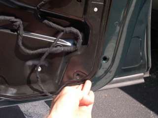 28. Remove the ten (10) 10mm bolts that secure the carrier panel to 