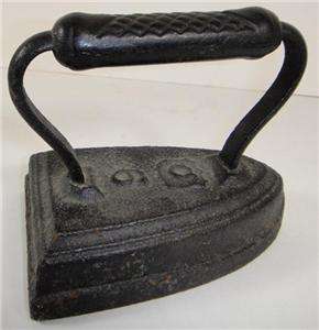IRON CAST OLD ANTIQUE METAL SAD USA RUSSIAN PAPERWEIGHT  